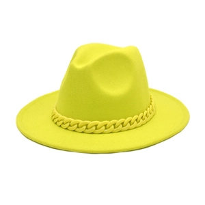 Detail of neon yellow wool fedora with a matching bold acrylic chain decoration