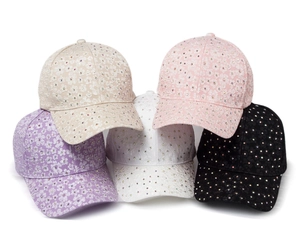 Detailed pile of lace baseball caps with rhinestones in apricot, pink, white, and purple