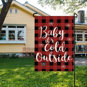Christmas garden flag with red buffalo plaid pattern and Baby it's Cold Outside text