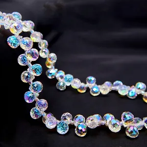 Macro view of multifaceted iridescent crystal glass drop beads with rainbow AB coating