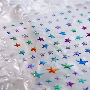 Colorful star-shaped laser nail art stickers with shimmering gradient glitter effect