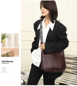 Brown leather crossbody tote bag featuring a stylish leopard print wide shoulder strap