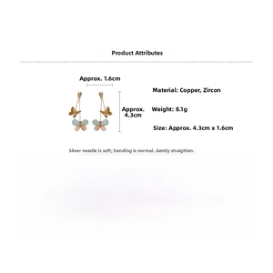 Detail view of butterfly tassel earrings featuring copper with zircons and silver posts