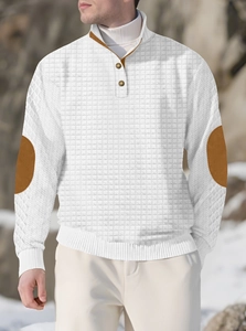 Detail of white waffle texture polo shirt featuring brown vintage elbow patches and buttons