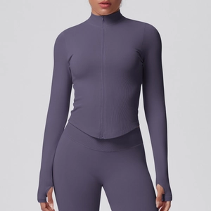 Detailed view of women's zip-up sports jacket with ribbed contouring and thumbhole cuffs