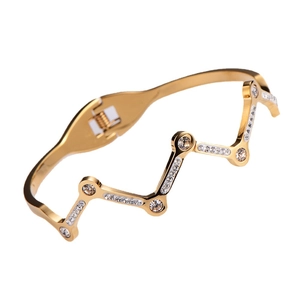 18k gold plated stainless steel wave bangle with white cubic zirconia in sawtooth design