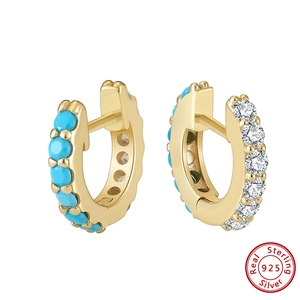 Detail of S925 silver gold hoop earrings with turquoise and clear zircon stones