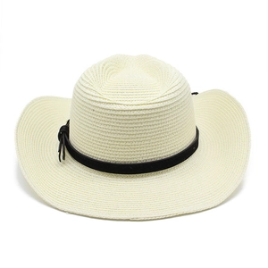 Detailed close-up of woven straw texture and black leather band on a western cowboy sun hat