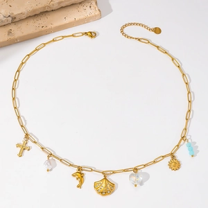 Gold plated stainless steel necklace with shell, dolphin and pearl charms on paperclip chain