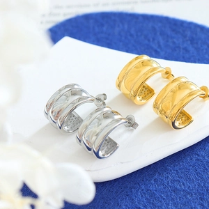 Minimalist 18K gold and silver C-shape embossed stud earrings in polished stainless steel