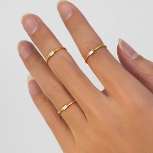 Minimalist gold stainless steel thin rings set with rectangular cubic zirconia stones
