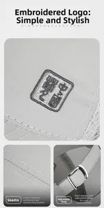Detail showing traditional Chinese embroidery and adjustable metal buckle on baseball cap