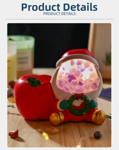 Detail of Santa Claus night light with purple crystals and decorative red apple container