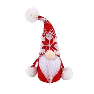 Christmas gnome decoration with red knitted snowflake hat and white faux fiber beard