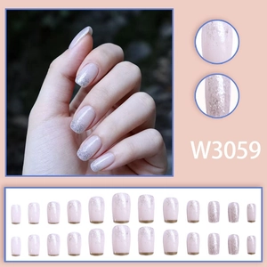 Detail view of pink gradient press-on nails with silver glitter tips and 24-piece set layout