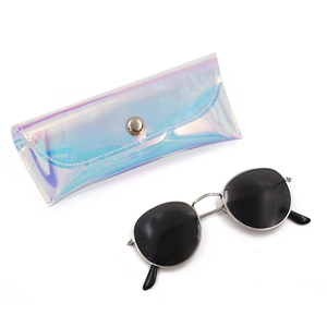 Detail of round sunglasses with silver frame and holographic PVC pouch with metal snap