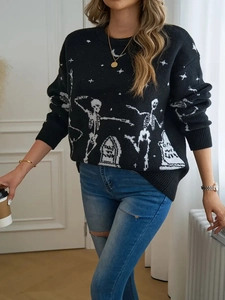 Women's black Halloween skull knit sweater paired with blue jeans in a cozy setting