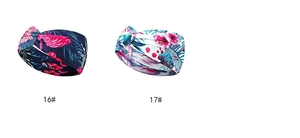 Detail of bohemian floral print twisted headbands in flamingo and hibiscus patterns