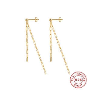 Detailed macro of 925 sterling silver gold fringe chain earrings with oval link tassels