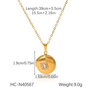 Detail shot of golden star moon locket necklace with size dimensions and weight info
