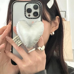 Clear phone case featuring a large metallic silver puffed heart stand for women