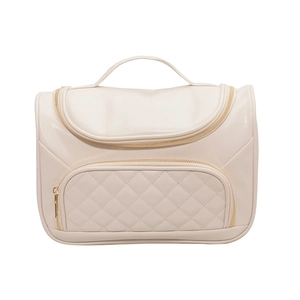 Beige cosmetic bag for women, large capacity travel toiletry bag with quilted design.