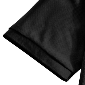 Macro shot of black pique fabric texture and ribbed elastic cuff on the polo shirt sleeve
