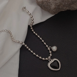 Retro hip-hop silver beaded bracelet featuring a black heart charm and pearl accent