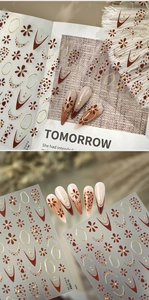 Detailed retro brown floral and gold line nail art stickers with model M-1284 on display