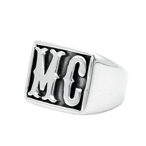 Detailed close-up of men's stainless steel signet ring with gothic MC letter design