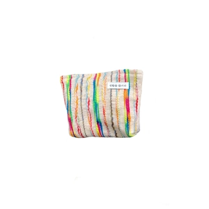 Colorful striped knitted cosmetic bag with vibrant vertical patterns and a minimalist label
