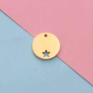 Close-up of golden stainless steel round pendant with star cut-out and hanging loop