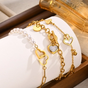 Elegant gold heart pearl bracelet set with OT toggle shell pendant and bell charms