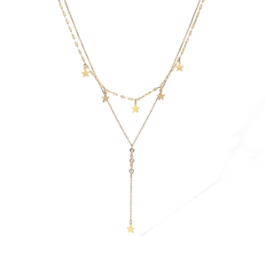 Detail of double-layer 18K gold plated necklace with star pendants and sparkling zircons