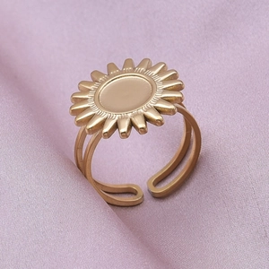 Close-up of golden sunflower stainless steel ring with an adjustable open band design
