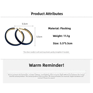 Detail showing 5.5cm dark blue flocked hoop earrings with gold hooks and silver pins