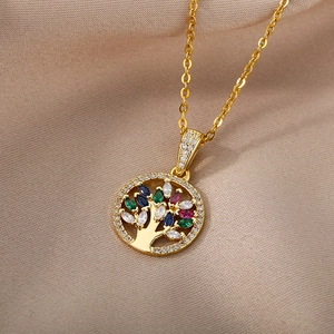 Golden Tree of Life necklace with colorful zircon stones on elegant silk background