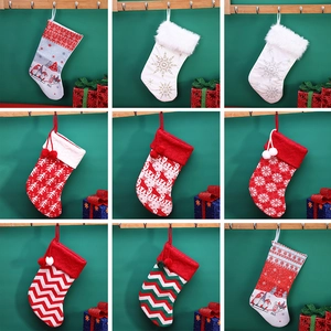 Collection of nine festive Christmas stockings with reindeer, gnomes and snowflake designs
