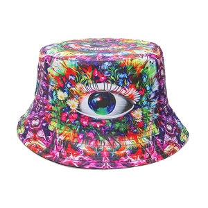 Detail of psychedelic bucket hat featuring a realistic eye print and colorful floral patterns
