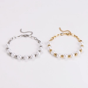 Detail of vintage pearl bracelets with gold and silver metal chains and ring links