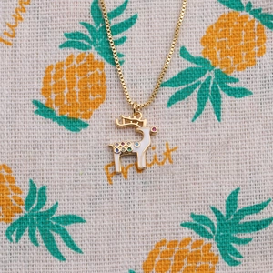 Chic gold-plated reindeer necklace with colorful cubic zirconia and white enamel details