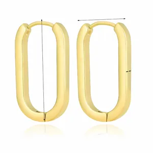 Detail view of oval geometry gold earrings showing 28.5mm size and polished 18k finish