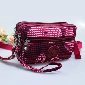Red heart pattern crossbody bag for women with multi-layer zippers and adjustable strap