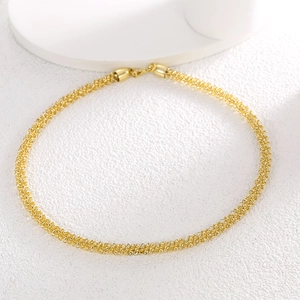 Minimalist gold woven mesh collar necklace with a refined metallic braided texture