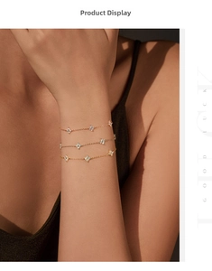Three-piece clover bracelets set in gold, rose gold and silver with sparkling stones