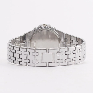 Rear view of silver stainless steel watch with diamond-set strap and solid case back