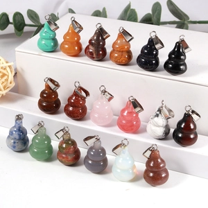 Collection of 18 diverse natural stone gourd pendants with metal clasps on a white display