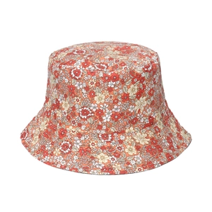 Women's floral print bucket hat with red and orange flowers on white background