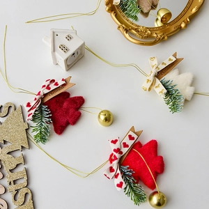 Plush Christmas tree bell ornaments in red and white with bows for festive home decor