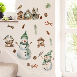 Detail of Christmas snowman wall decals with pinecones and birdhouses on a white wall
